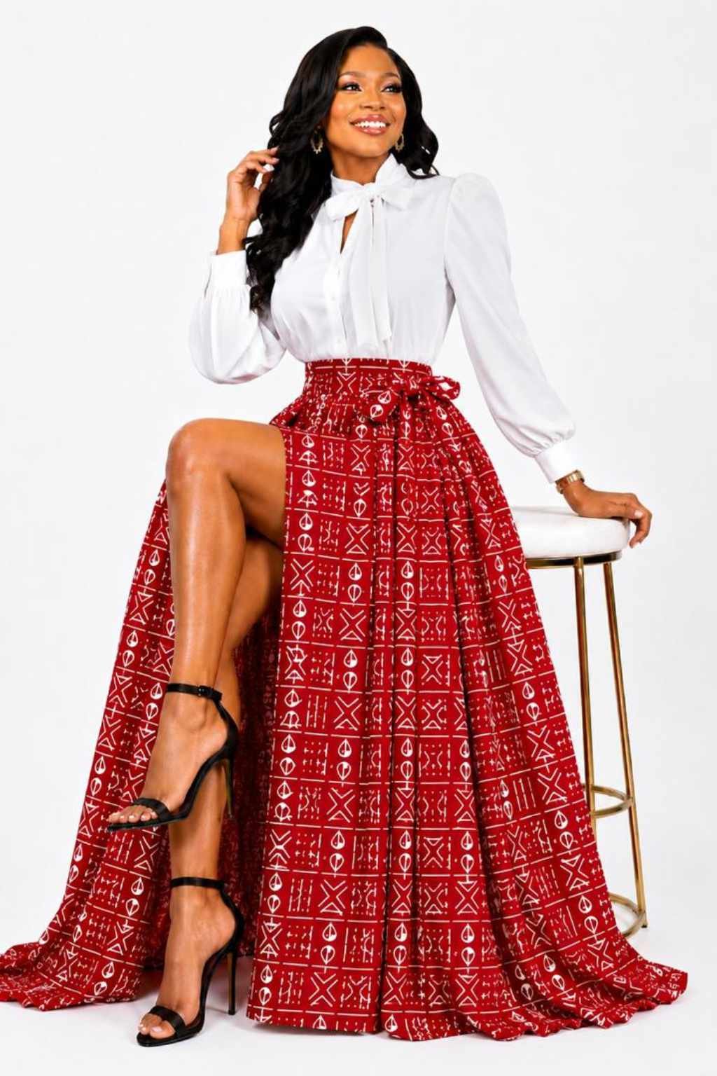 Red & White Mudcloth African Print Maxi Skirt 3 Woman wearing a red and white mudcloth bogolan African print high-waisted pleated maxi skirt - without split view