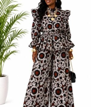 Woman wearing a brown, black and cream circle batik African print peplum top and wide-leg pants set