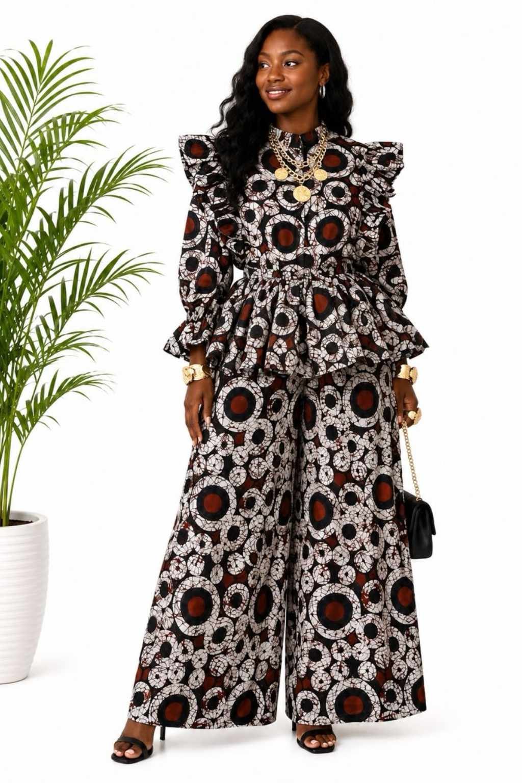 Woman wearing a brown, black and cream circle batik African print peplum top and wide-leg pants set