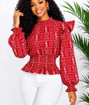 Woman wearing a red and white mudcloth bogolan African print ruffle peplum top