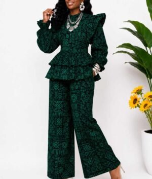 Woman wearing a deep green and black tribal African print peplum top and wide-leg pants set