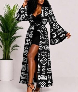 Woman wearing a black and white tribal symbol African print long kimono duster with bell sleeves