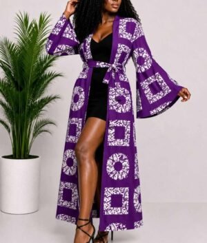 Woman wearing a purple and white batik squares African print long kimono duster with bell sleeves