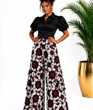 Woman wearing white, red and black circle batik African print wide-leg palazzo pants