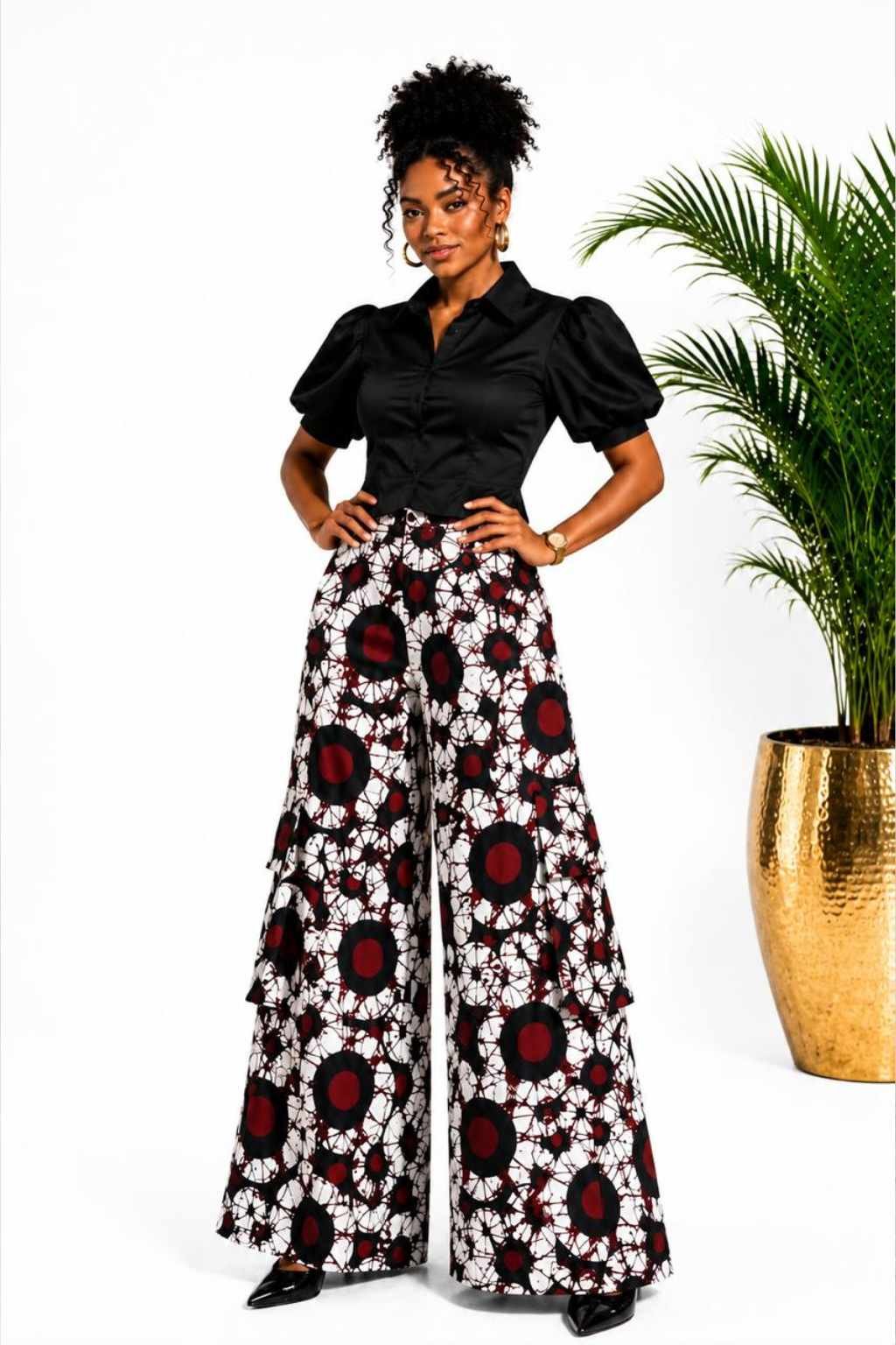 Woman wearing white, red and black circle batik African print wide-leg palazzo pants