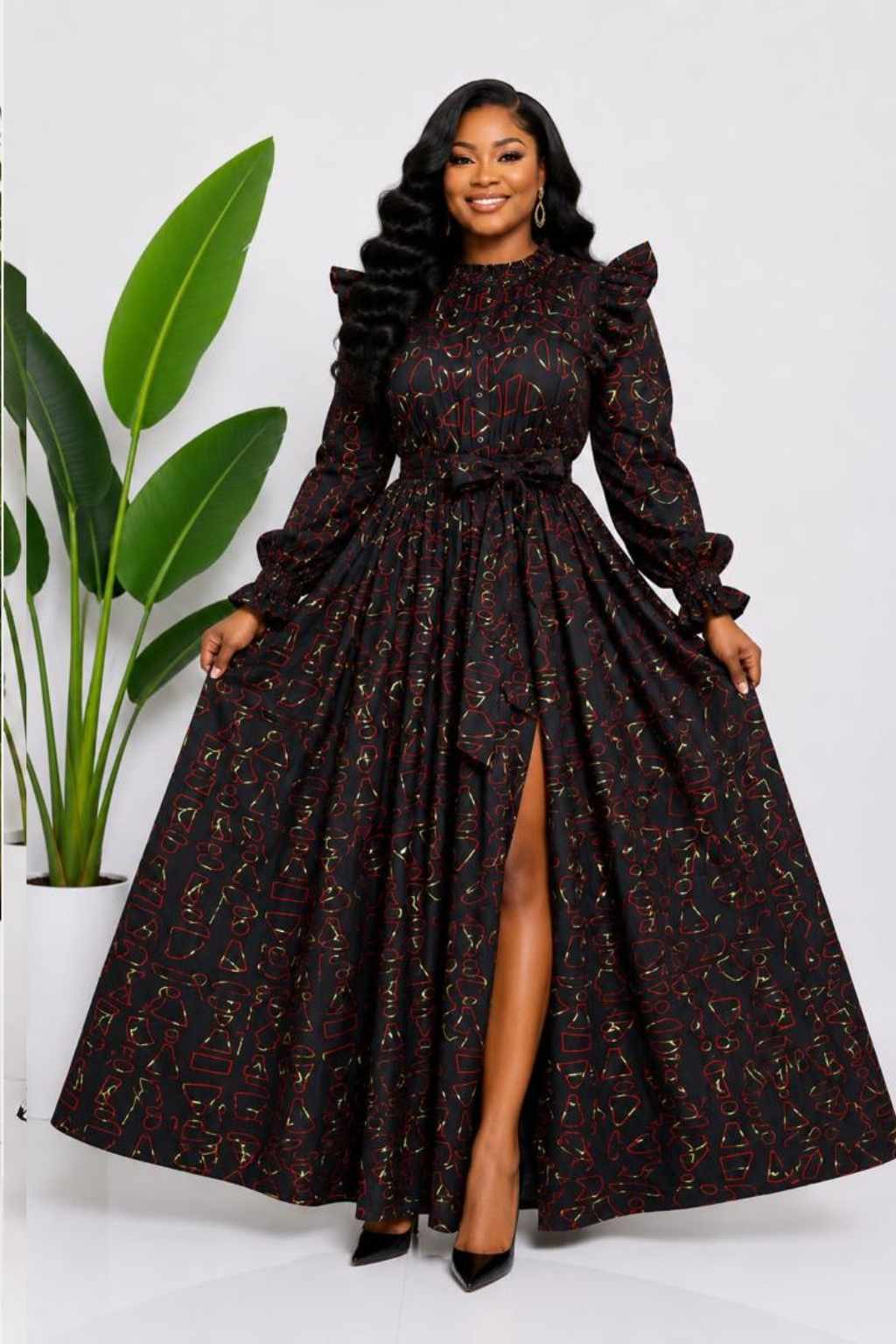 Black Red & Gold Abstract African Print Top & Skirt Set 2 Woman wearing a black, red and gold abstract African print two-piece top and maxi skirt set - view 2