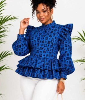 Woman wearing a blue and black tribal African print ruffle peplum top