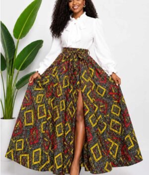 Woman wearing a black, red and yellow geometric African print high-waisted pleated maxi skirt