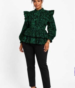 Woman wearing a green and black tribal African print ruffle peplum top