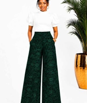 Woman wearing green and black tribal African print wide-leg palazzo pants