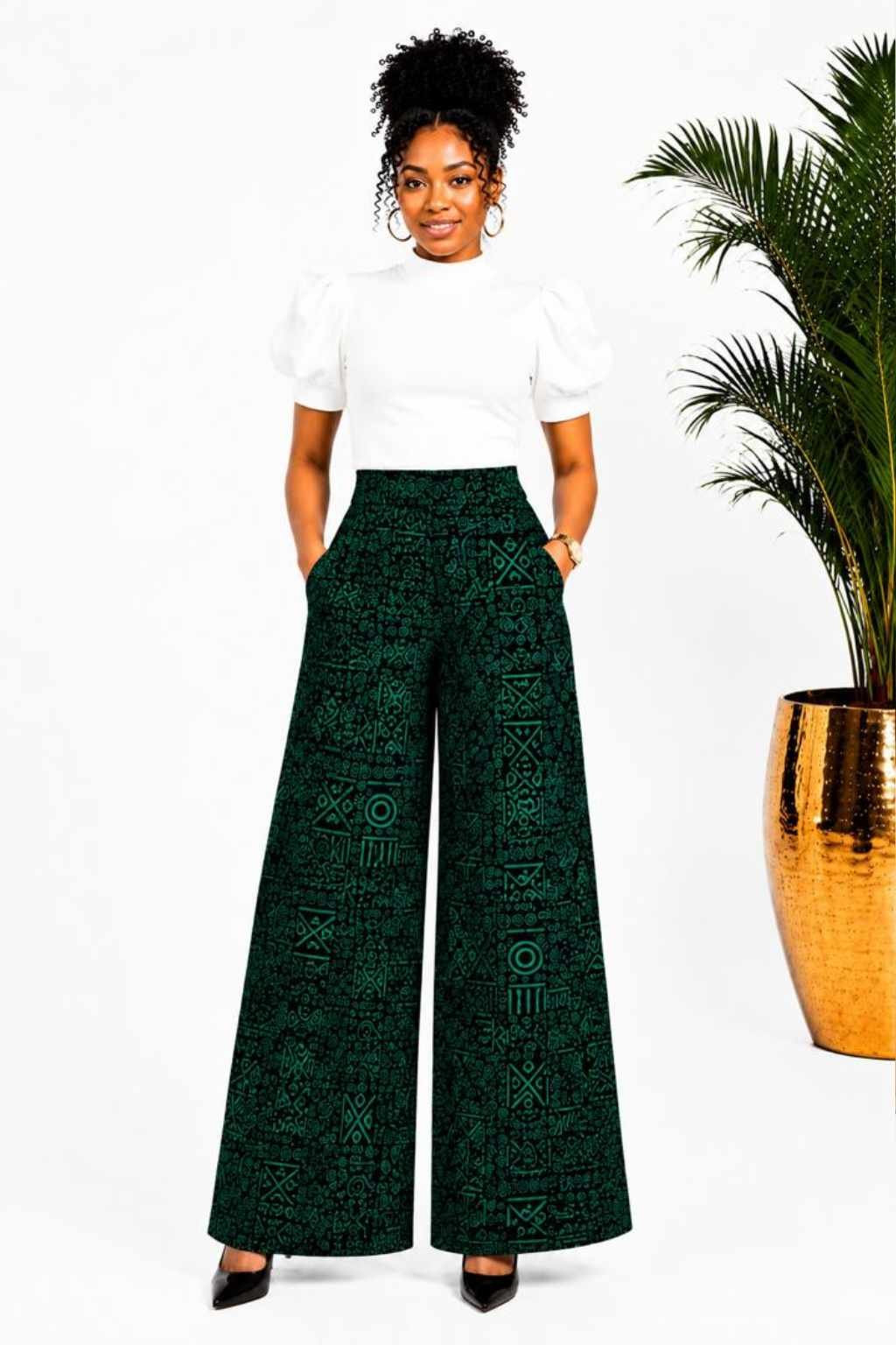 Woman wearing green and black tribal African print wide-leg palazzo pants