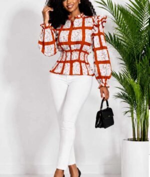 Woman wearing a rust orange and cream windowpane check African print ruffle peplum top
