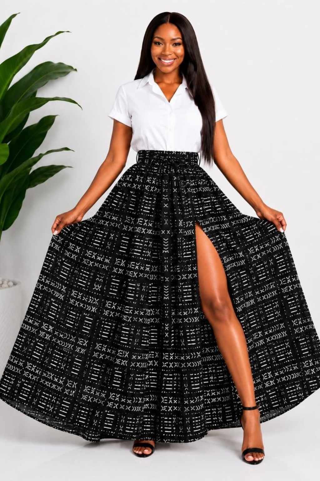 Black & White Mudcloth African Print Maxi Skirt 2 Woman wearing a black and white mudcloth bogolan African print high-waisted pleated maxi skirt - without split view