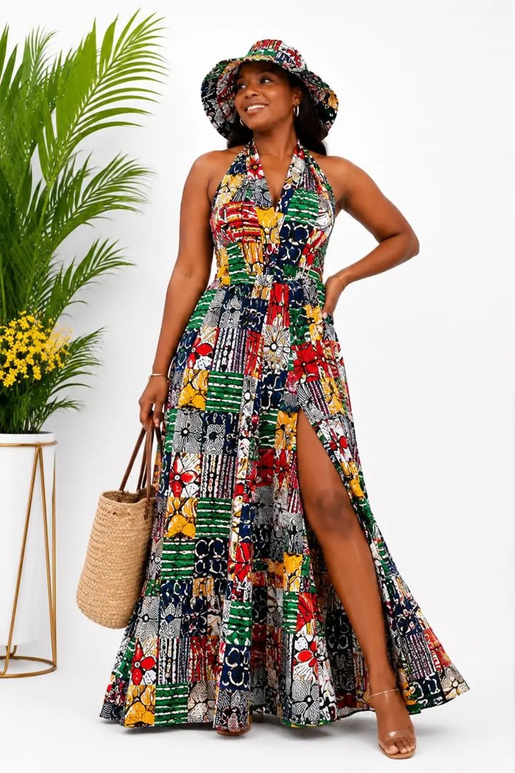 Woman wearing a multicolor patchwork African print halter-neck maxi dress