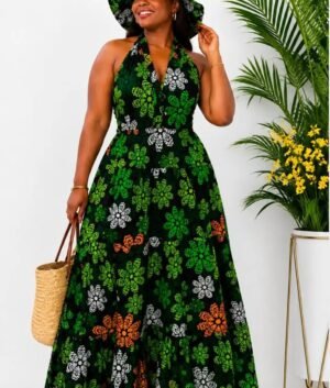 Woman wearing a green floral African print halter-neck maxi dress