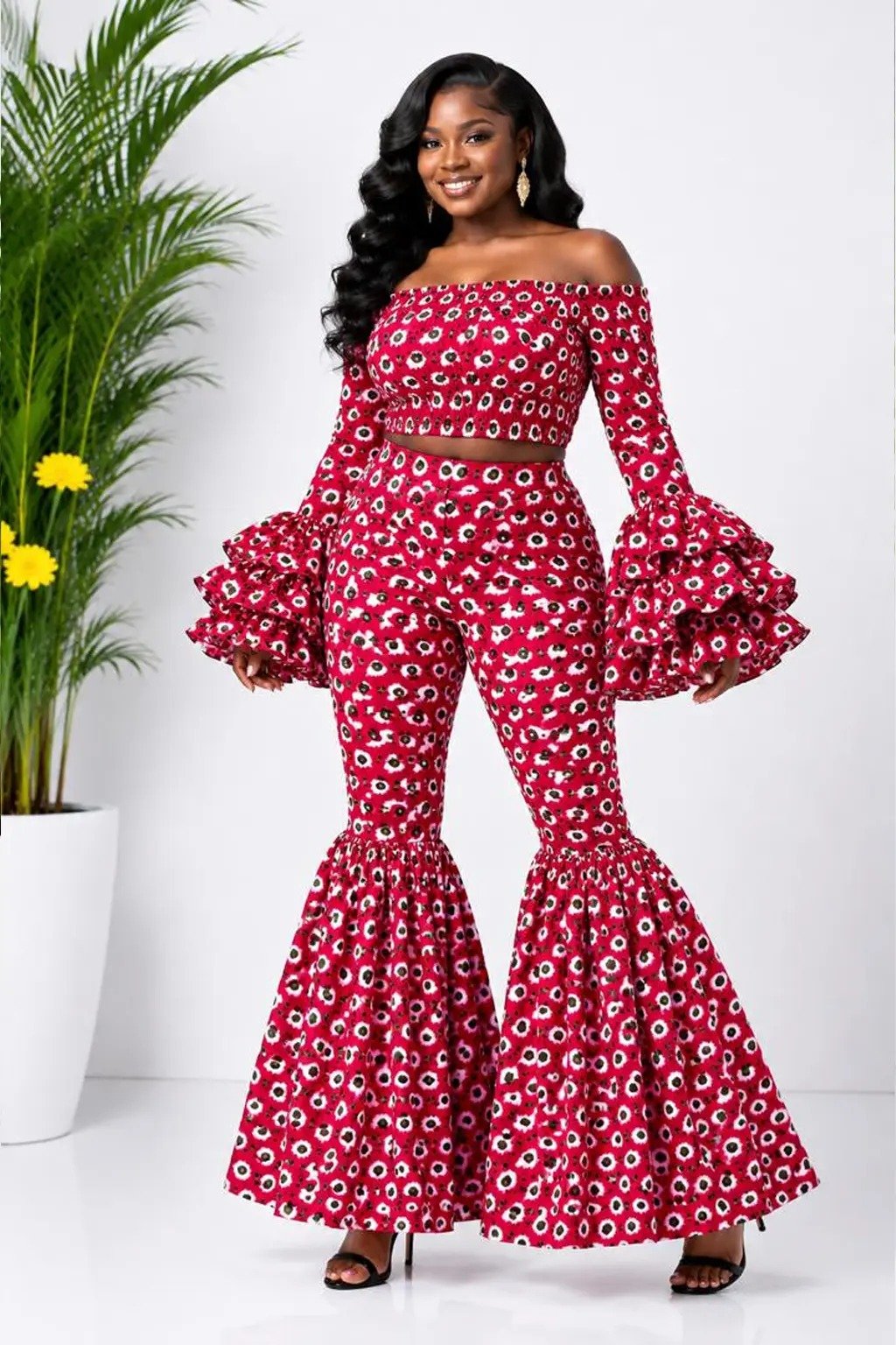 Red Floral African Print Off-Shoulder Bell Sleeve Top & Flare Pants Set 2 Woman wearing a red floral African print off-shoulder bell-sleeve top and flare-leg pants set - view 2