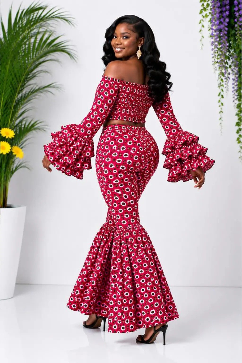 Red Floral African Print Off-Shoulder Bell Sleeve Top & Flare Pants Set 3 Woman wearing a red floral African print off-shoulder bell-sleeve top and flare-leg pants set - view 3