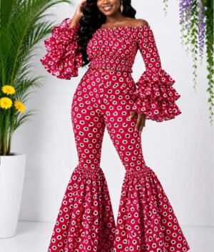 Woman wearing a red floral African print off-shoulder bell-sleeve top and flare-leg pants set