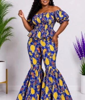 Woman wearing a blue and yellow paisley African print off-shoulder top and flare-leg pants set - view 2