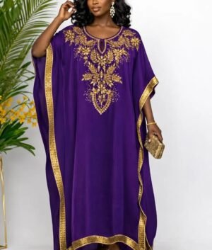 Woman wearing a purple gold-embellished kaftan maxi gown