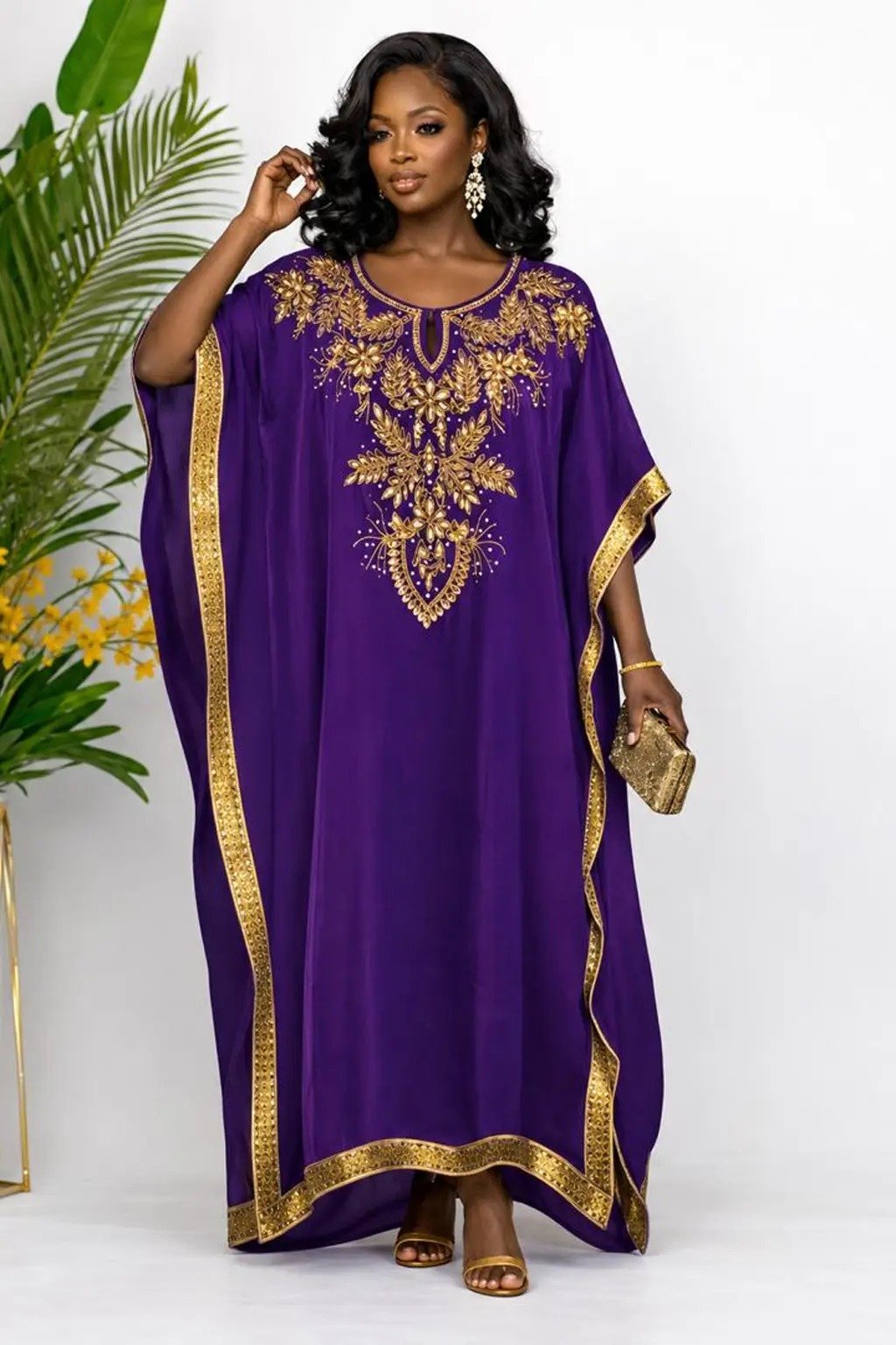 Woman wearing a purple gold-embellished kaftan maxi gown