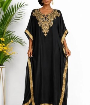 Woman wearing a black gold-embellished kaftan maxi gown