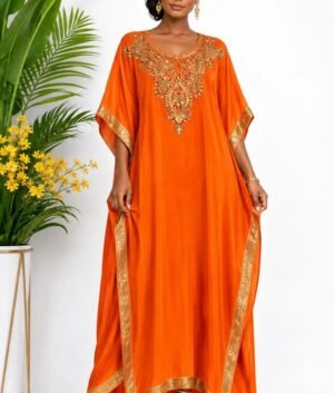 Woman wearing a orange gold-embellished kaftan maxi gown