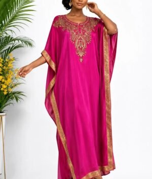 Woman wearing a magenta gold-embellished kaftan maxi gown
