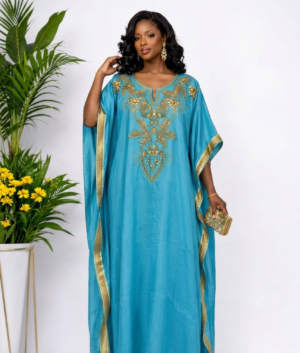Woman wearing a Luxury Turquoise Blue Gold -embellished kaftan maxi gown