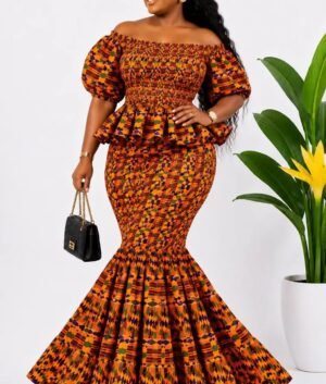 Woman wearing an orange kente African print off-shoulder peplum mermaid maxi dress