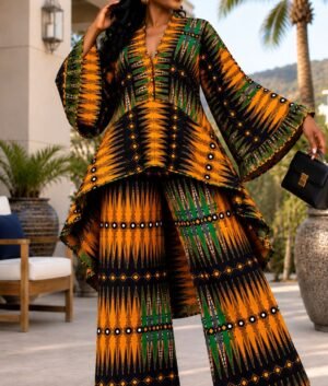 A Woman Wearing A Marigold & Emerald Geometric Asymmetric High-Low Top And Wide-Leg Pants Set.
