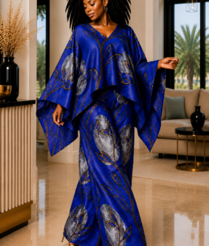 A Woman Wearing A Royal Blue African Pants Set, Silver Floral Kaftan Top Wide Leg Trousers And Luxury Co-Ord Boubou Set.