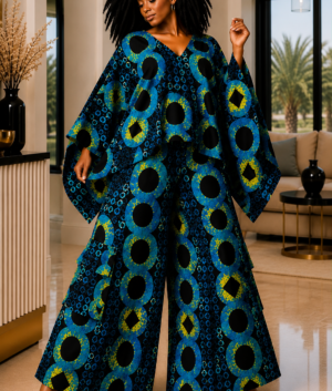 A Woman Wearing A Sapphire & Marigold Interlocking Circle Poncho Top & Wide-Leg Pants Set.