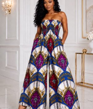 Woman Modelling An African Print Wide Leg Palazzo Romper. Vibrant Royal Blue and Purple Geometric Statement Bodysuit. Elegant Wedding Guest Outfit & Summer Streetwear. Strapless Ankara Jumpsuit with Pockets.