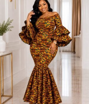 Woman Wearing A Luxury Ankara Mermaid Maxi Dress – Gold, Ochre & Emerald And Kente Off-Shoulder Gown with Ruffle Sleeves.