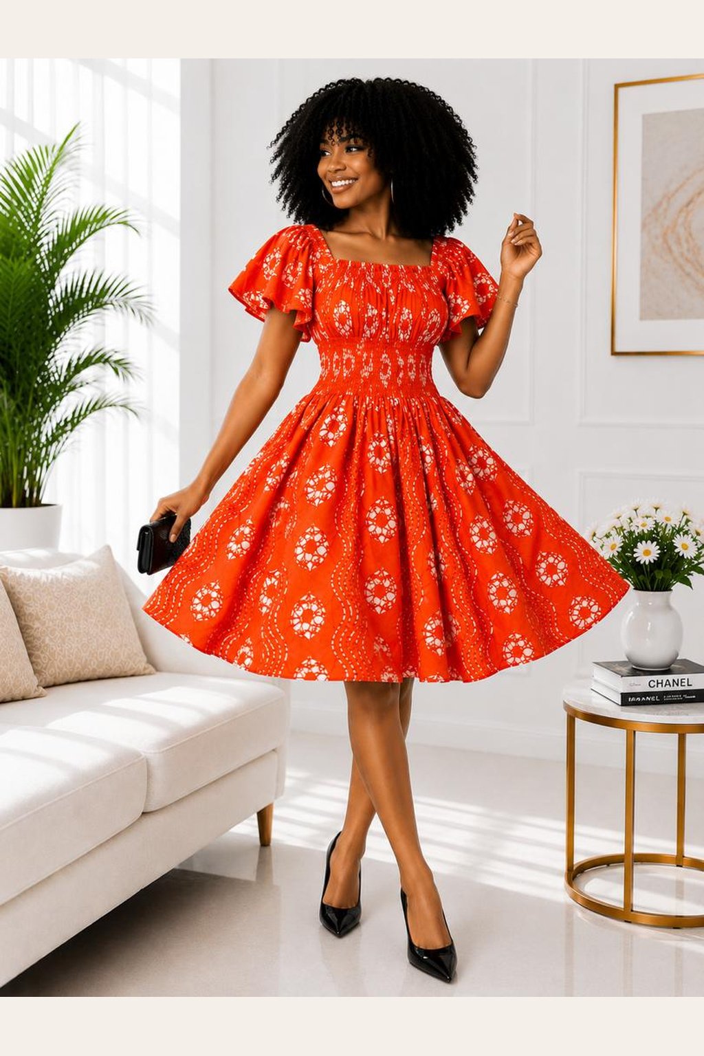 Woman Wearing A Zuri Smocked A-Line Midi Dress – Terracotta Orange and White Abstract African Print.