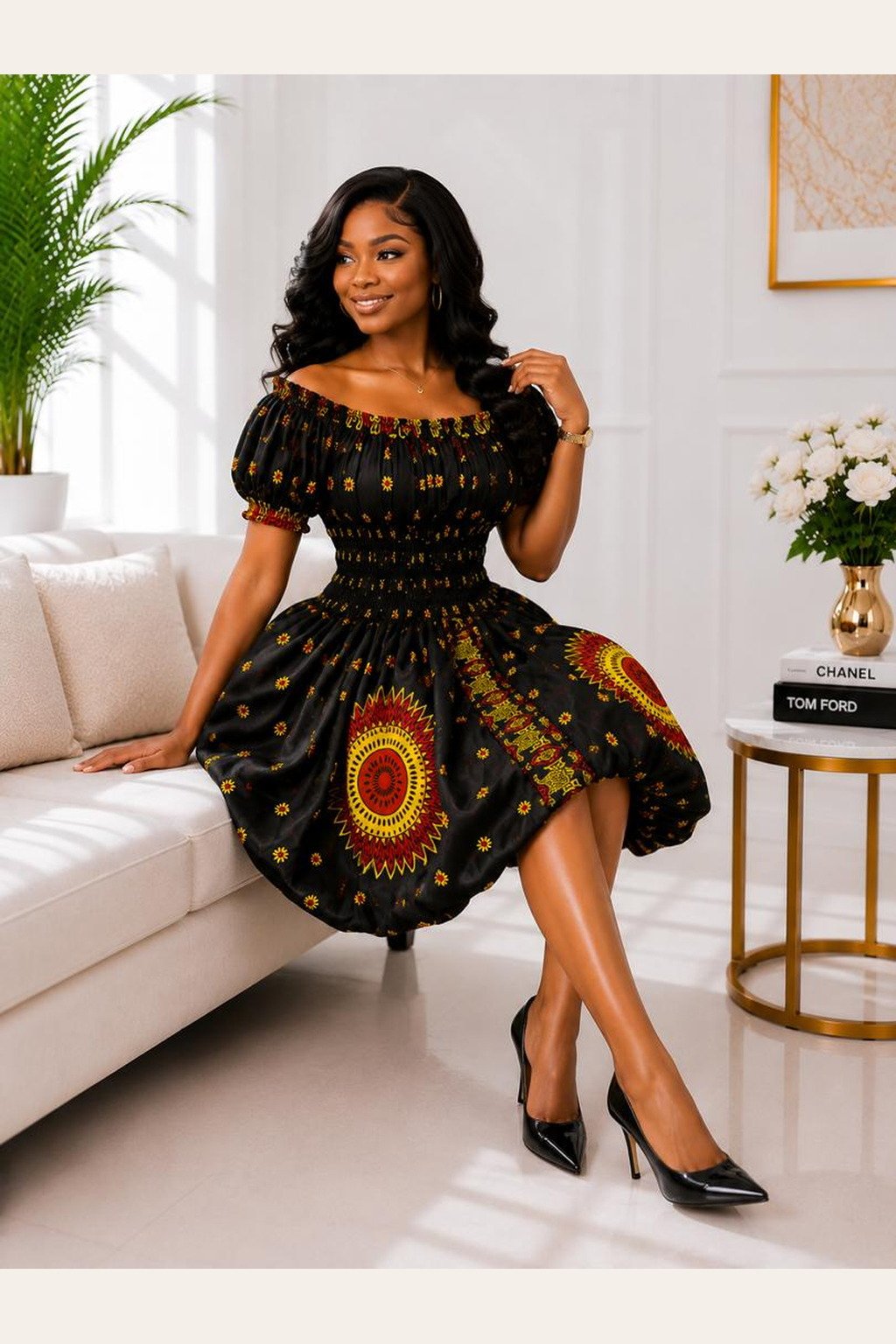 A Woman Wearing A Zuri African Balloon Mini Dress – Black Ankara Print Gown with Sunburst Medallion and Bubble Hem.