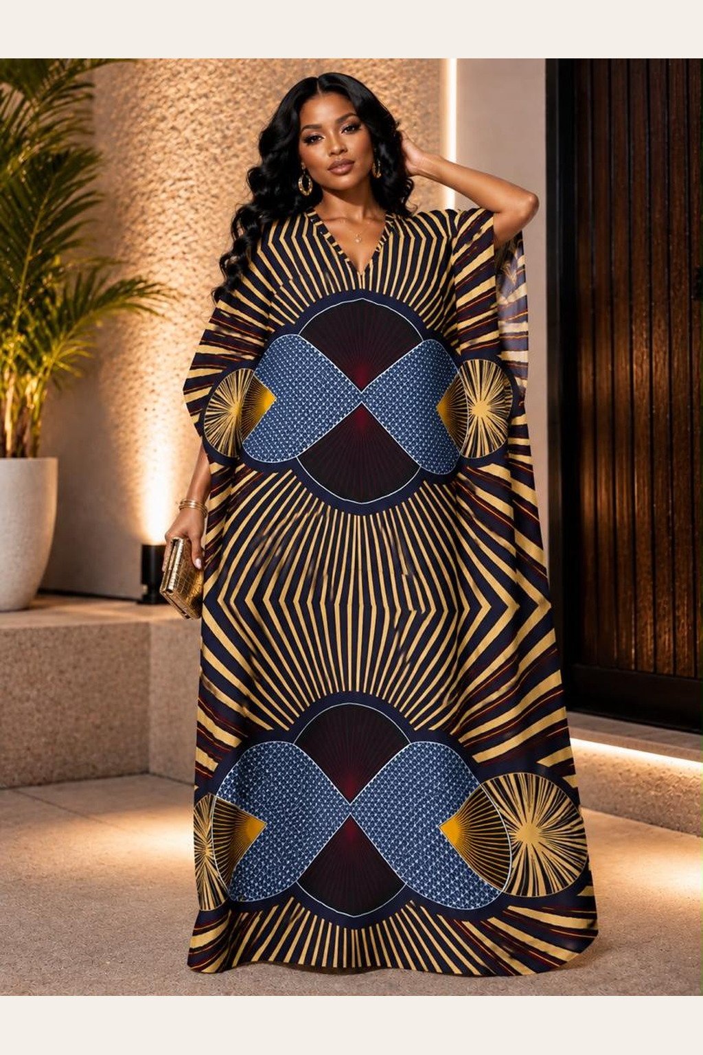 A Woman Wearing A Luxury Ankara Kaftan Gown, Royal Blue and Gold Geometric Kaleidoscope Boubou Dress.