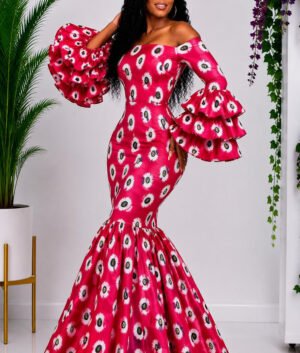 A Woman Wearing A Magenta Pink Ankara Print Dress and Mermaid Gown with Dramatic Three-Tiered Ruffles.