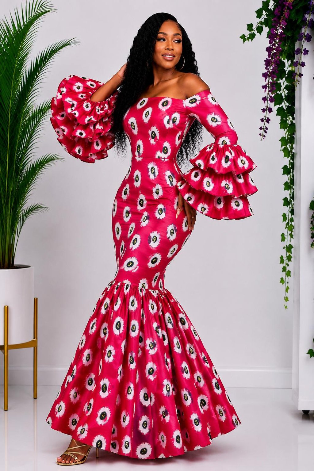 A Woman Wearing A Magenta Pink Ankara Print Dress and Mermaid Gown with Dramatic Three-Tiered Ruffles.