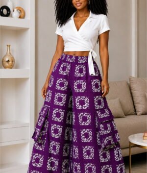 A Woman Wearing A Royal Purple and White Geometric Patchwork Palazzo Trousers And Wide-Leg Ankara Cargo Pants Only.