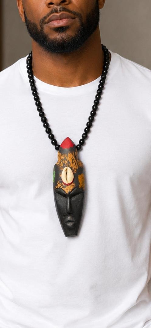 Hand Carved African Mask Necklace, Wooden Statement Pendant, Black Beaded Tribal Choker, Men Unisex Cowrie Shell Jewelry And Authentic Artisan Gift. 6 Man Wearing A Hand Carved African Mask Necklace, Wooden Statement Pendant, Black Beaded Tribal Choker, Men Unisex Cowrie Shell Jewelry And Authentic Artisan Gift.