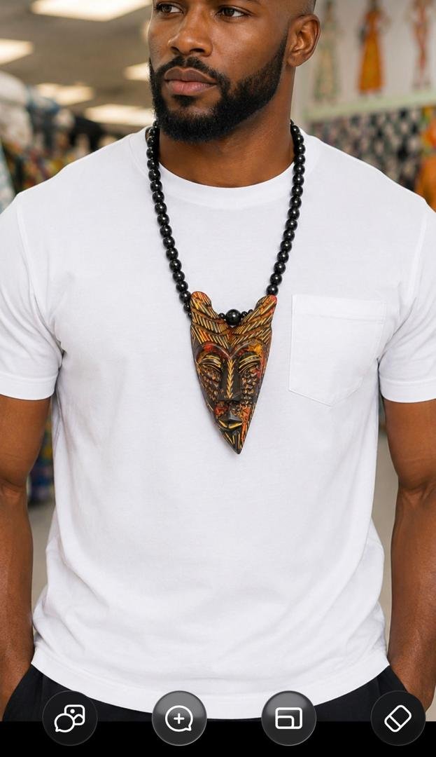 Hand Carved African Mask Necklace, Wooden Statement Pendant, Black Beaded Tribal Choker, Men Unisex Cowrie Shell Jewelry And Authentic Artisan Gift. 7 Man Wearing A Hand Carved African Mask Necklace, Wooden Statement Pendant, Black Beaded Tribal Choker, Men Unisex Cowrie Shell Jewelry And Authentic Artisan Gift.