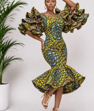 A Woman Wearing A Royal Rosette Ankara Multi-Tiered Ruffle Mermaid Midi Dress.