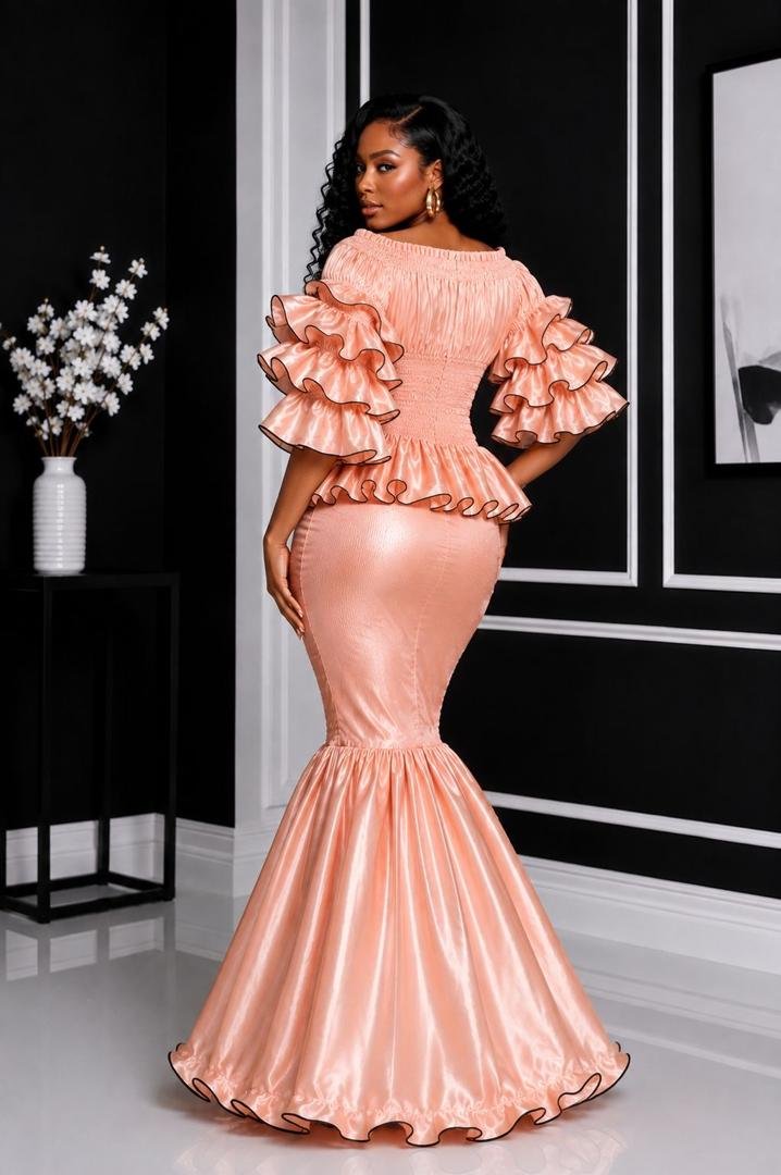 Elastic Luminous Peach Rose Gold Smocked Peplum Top & Ruffle Mermaid Maxi Skirt Set. 3 A Woman Wearing An Elastic Luminous Peach Rose Gold Smocked Peplum Top & Ruffle Mermaid Maxi Skirt Set.