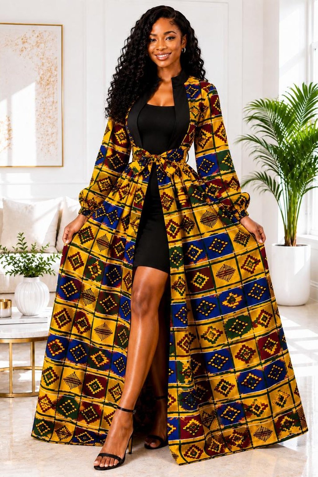 A Woman Wearing An Empress Kente Print Maxi Duster Jacket & Black Bodycon Dress Set.