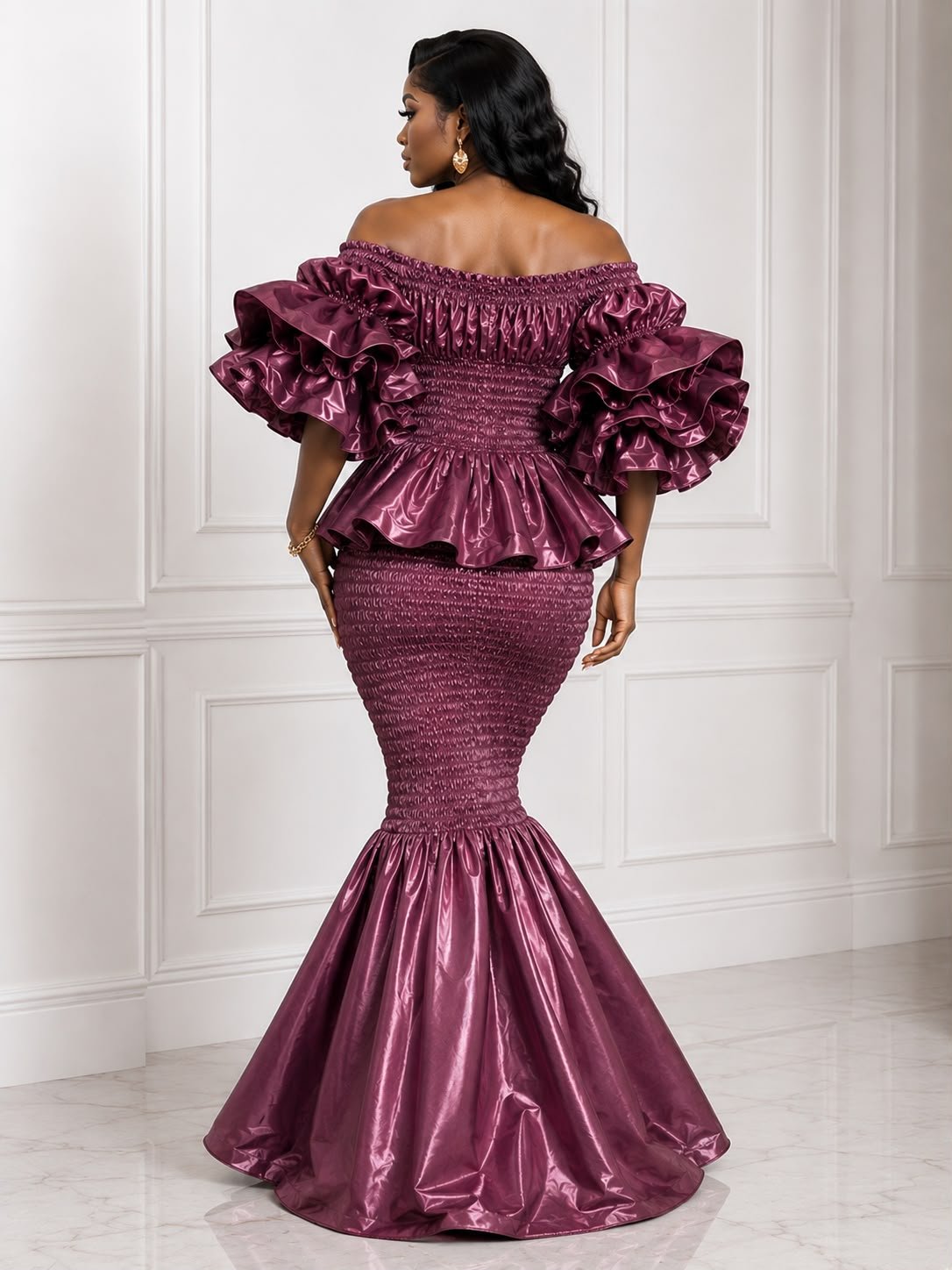 Zuri Metallic Smocked Mermaid Dress – Deep Plum Satin Two-Piece Gown with Dramatic Tiered Ruffles. 2 Woman Wearing A Zuri Metallic Smocked Mermaid Dress – Deep Plum Satin Two-Piece Gown with Dramatic Tiered Ruffles.