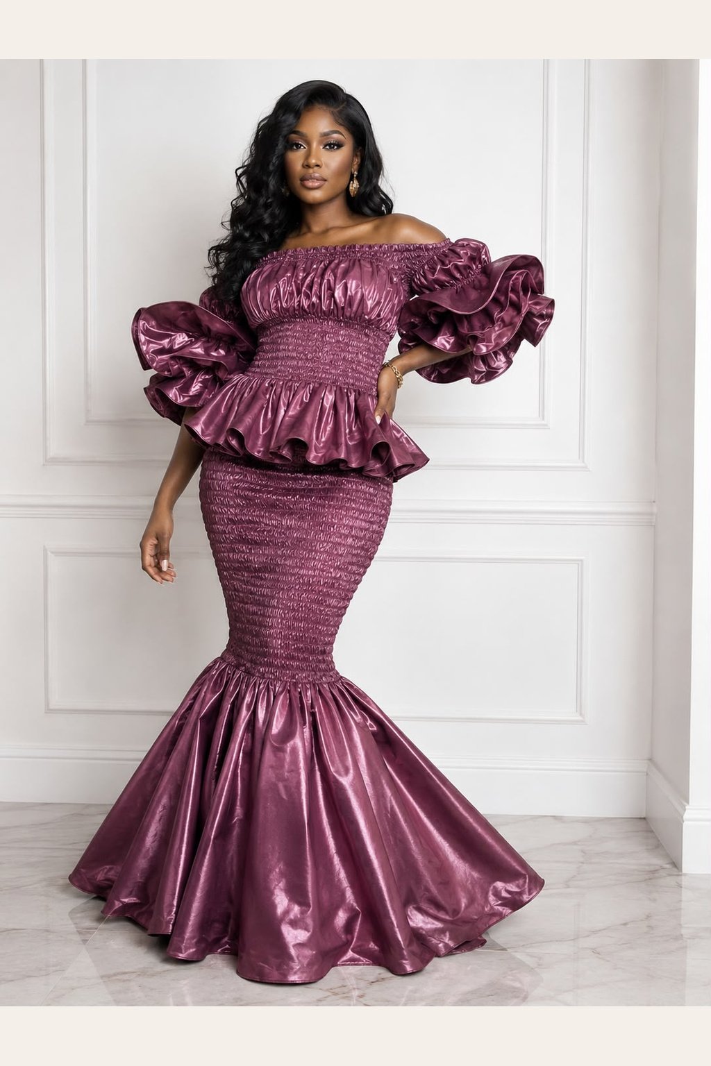 Woman Wearing A Zuri Metallic Smocked Mermaid Dress – Deep Plum Satin Two-Piece Gown with Dramatic Tiered Ruffles.