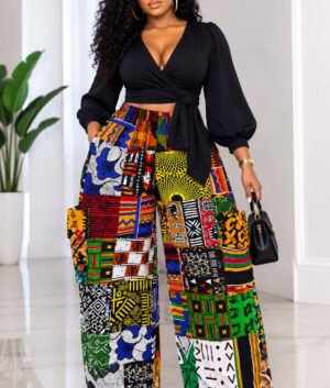 Woman Wearing An African Print Patchwork Wide Leg Pants Set, Ankara Cargo Trousers with Black Wrap Crop Top And Multi Pattern Tribal Co-ord Set.
