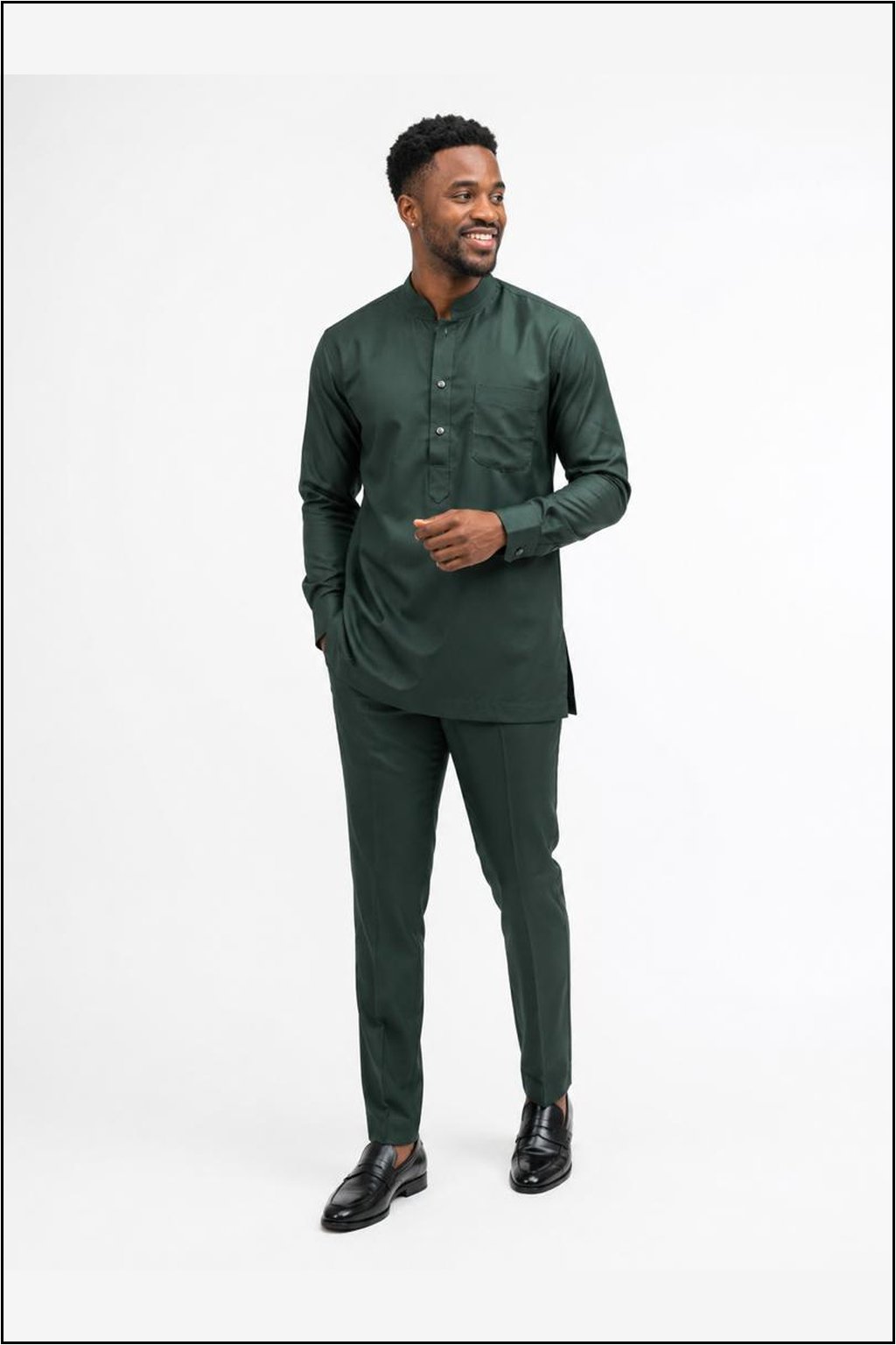 Man Wearing All‑Emerald Green African‑Inspired Long Sleeve Set, Modern Kaftan Shirt & Slim Pants.